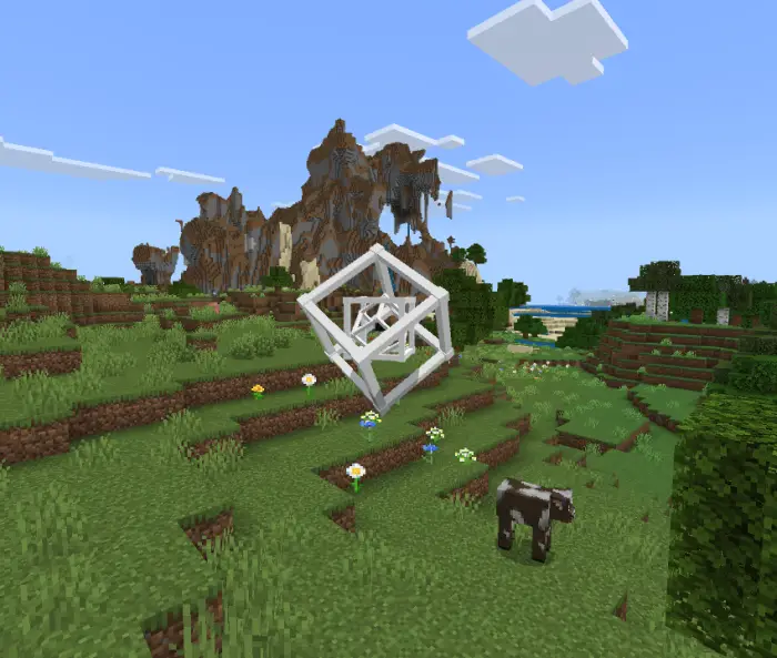 Floating geometric companion above grassy field.