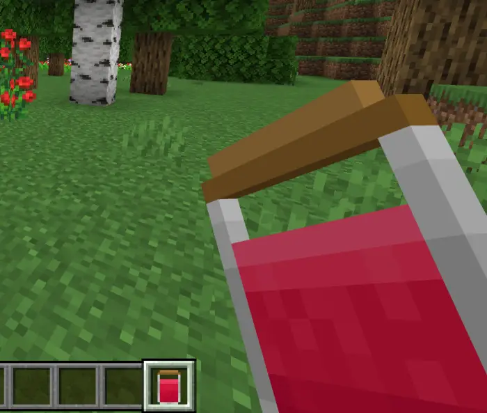 Player holding a red potion in a forest.