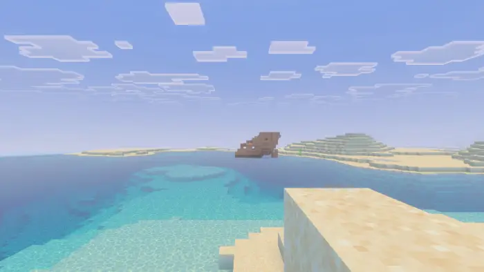 Endless sandy beach with clear blue water