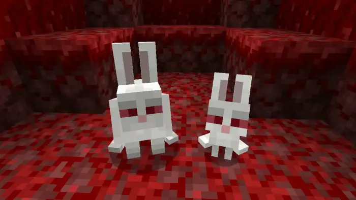 Two white bunnies with glowing red eyes