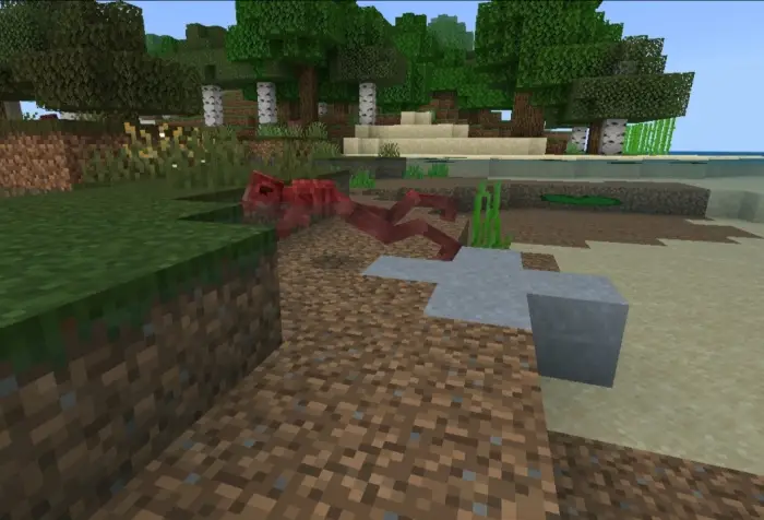 Red hostile hatchling mob near shoreline.