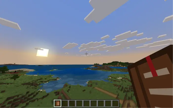 Player holding skill book at sunset