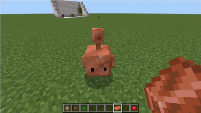 Cute copper block creature on grass field