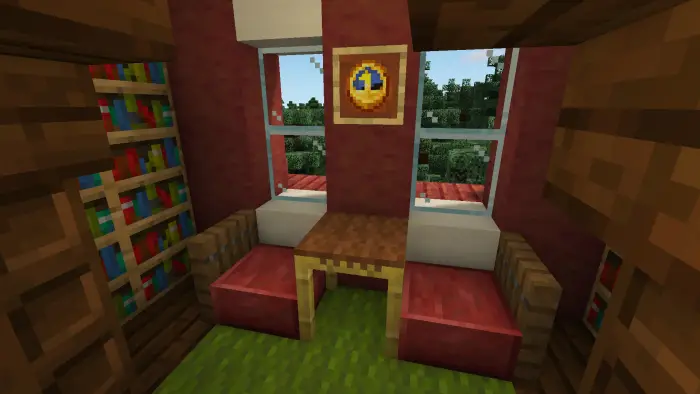 Cozy reading nook with table and chairs.