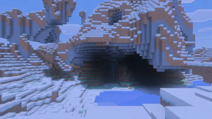 Snowy cave entrance in a frozen landscape