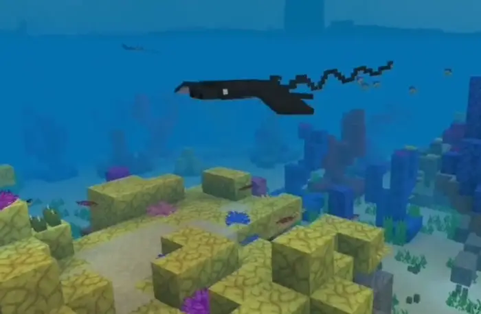 Pixel bat ray swimming in colorful coral reef