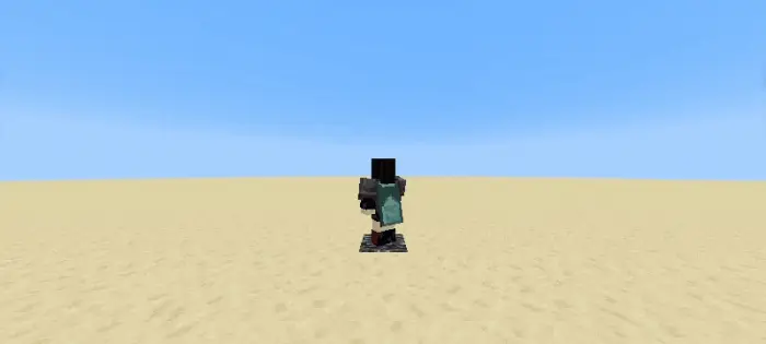 Character wearing a blue cape on sandy terrain