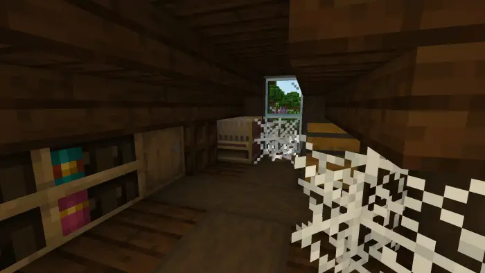 Dusty attic room with cobwebs and bookshelf