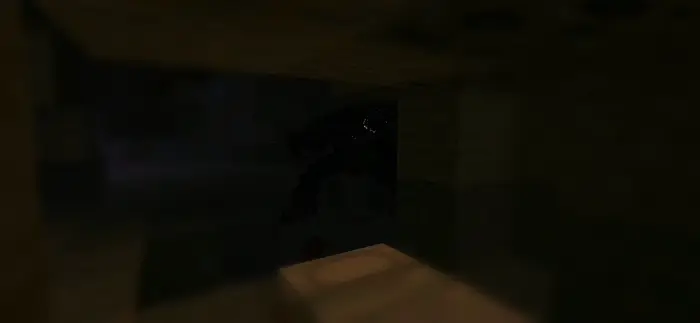 Dark cave with eerie creature lurking.