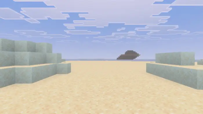 Blocky sandy beach with distant island