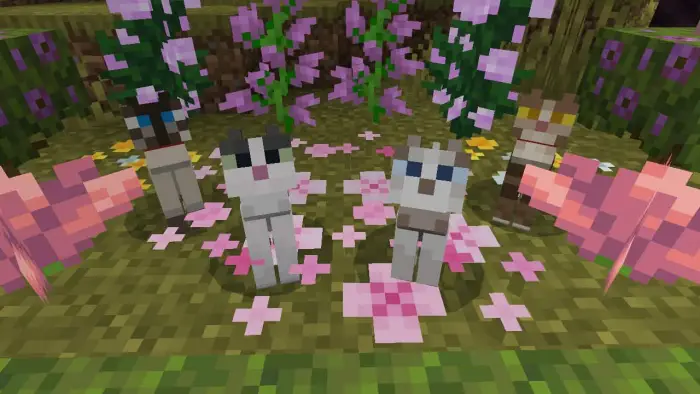 Blocky cats surrounded by pink flowers.