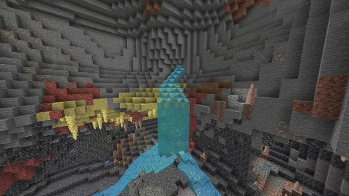 Clear water flowing in vibrant cave system