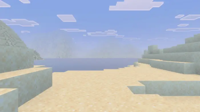 Sandy coastline with calm blue water