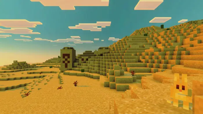 Blocky desert landscape with sandy hills.