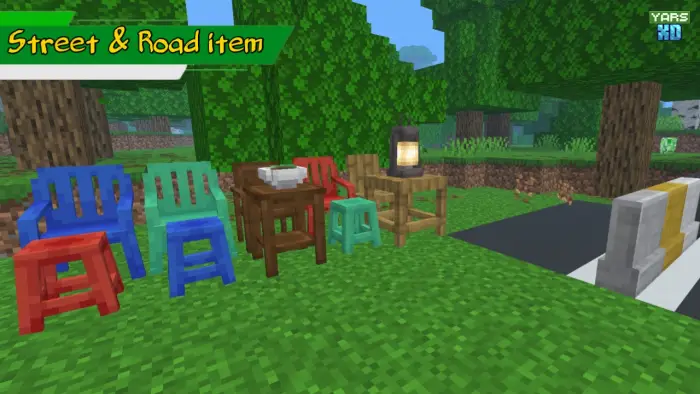 Colorful chairs and tables by a roadside.