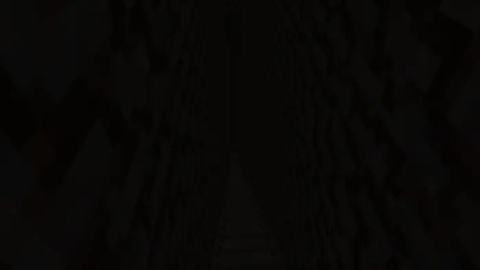 Dark, narrow corridor with steep stairs down