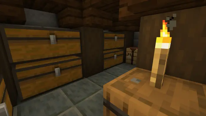 Wooden chests and torch in cozy storage room