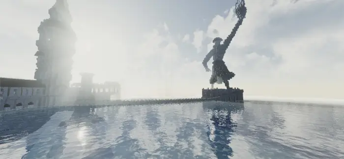 Tower and statue reflected on vibrant water
