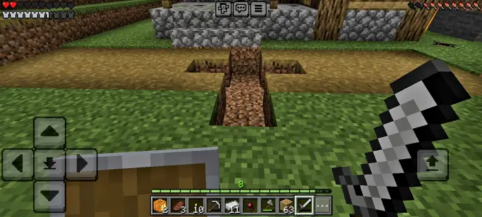 First-person view with sword near eerie trench.