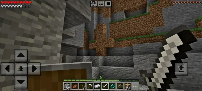 Player exploring a rocky cave with a sword