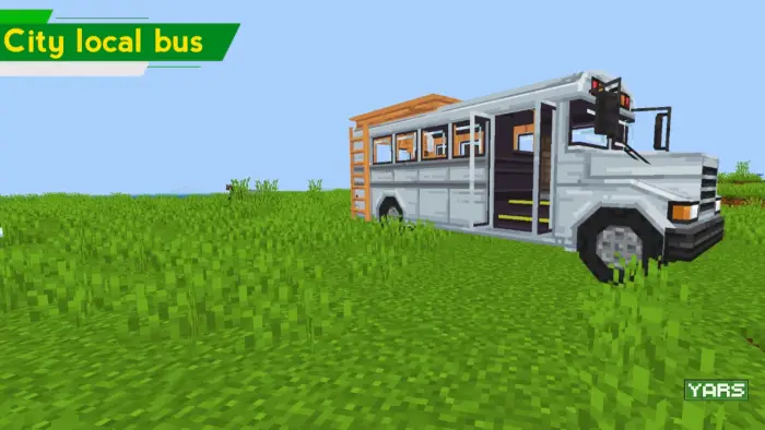 Blocky white city bus on grassy terrain.