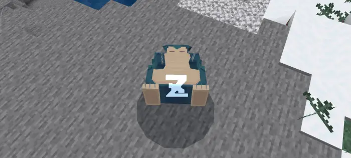 Sleeping Pok&eacute;mon character on rocky terrain