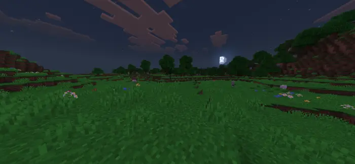 Moonlit grassy field with vibrant colors