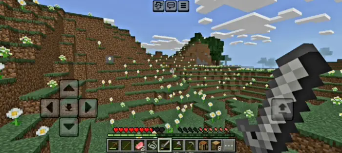 Player explores grassy hills with sword drawn