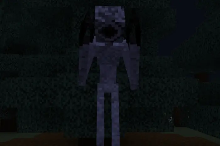 Pale monster with black eyes in dark forest