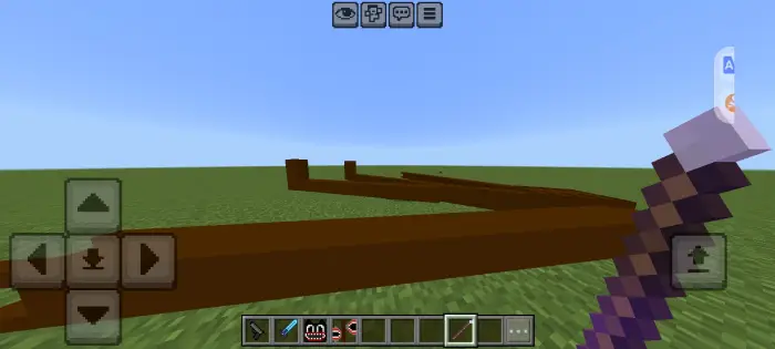Long brown mob structure on flat green terrain