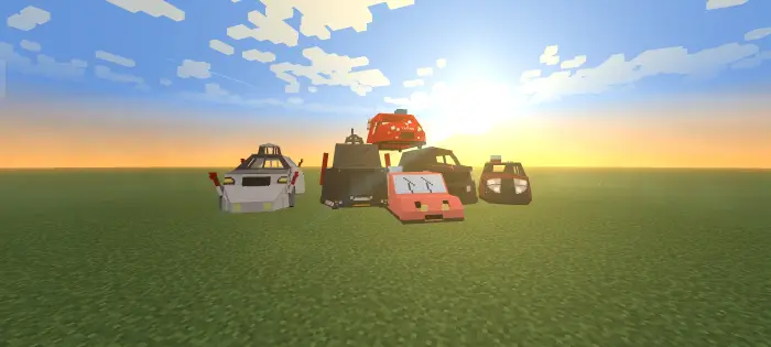 Six blocky storm chase vehicles on grass.