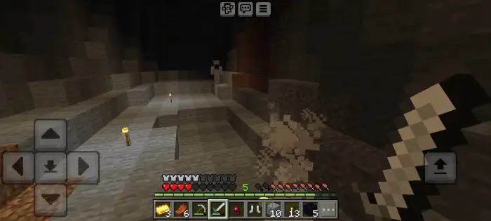 ALT text Player explores dark cave with ghostly figure
