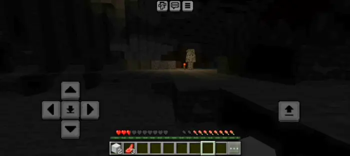 Dark cave with mysterious entity ahead