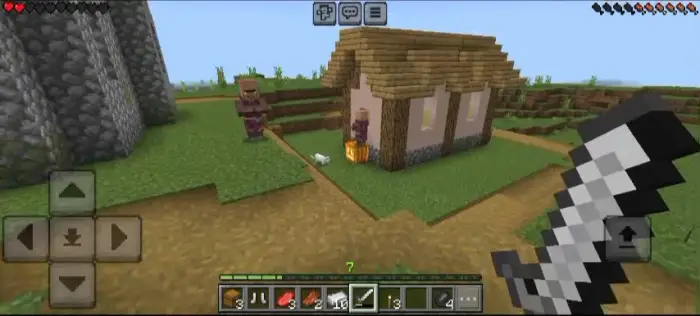 Two villagers near a small house, sword ready.