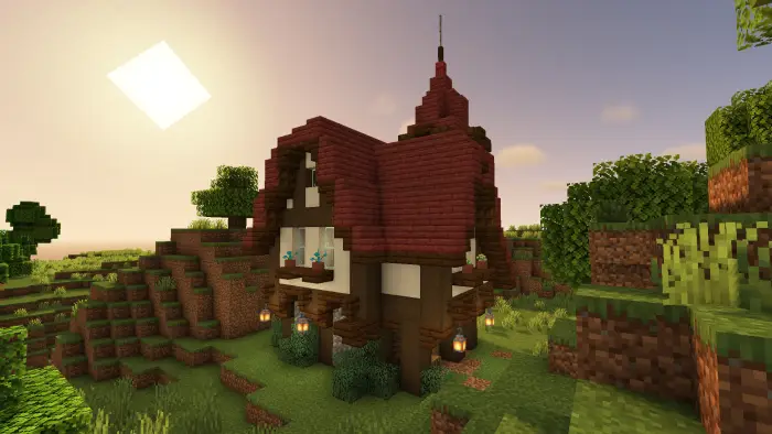 Cozy cottage with red roof in grassy hills