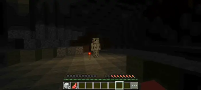 ALT Creepy entity stands in a dark cave