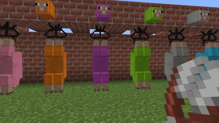 Colorful sheep suspended in a brick pen