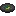 Green-eyed ghast icon with dark background