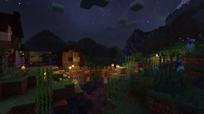 Warm lantern-lit village under starry sky