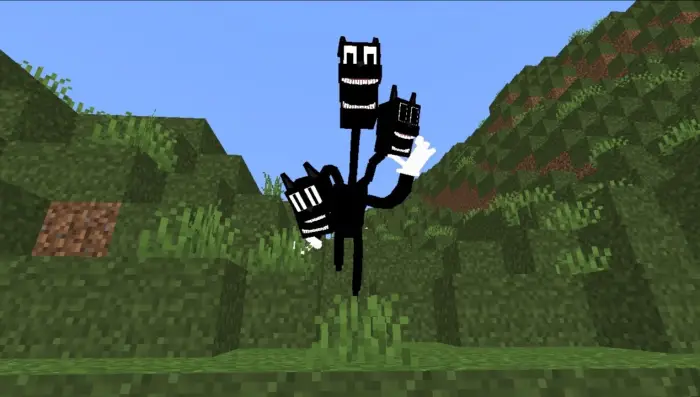 Three-headed cartoon creature in grass