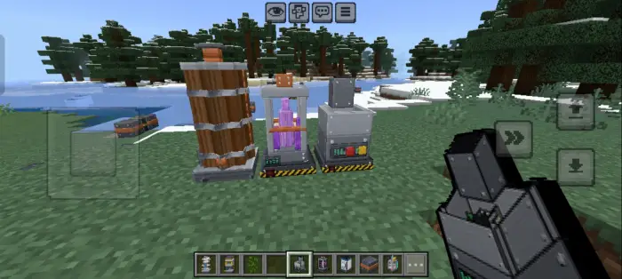 Three industrial machines on grass field.