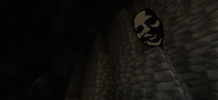 Creepy face peering from stone wall shadows