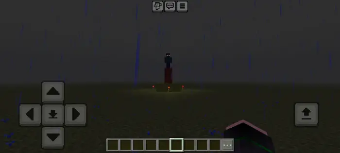 Dark figure stands on pedestal in the rain