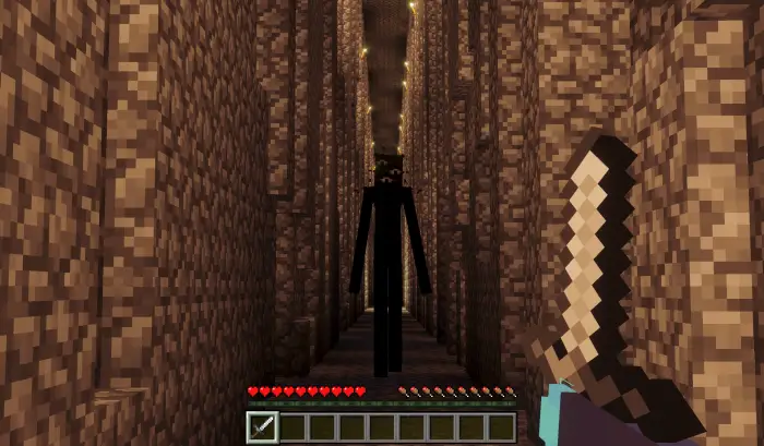 Player faces tall dark entity in eerie corridor