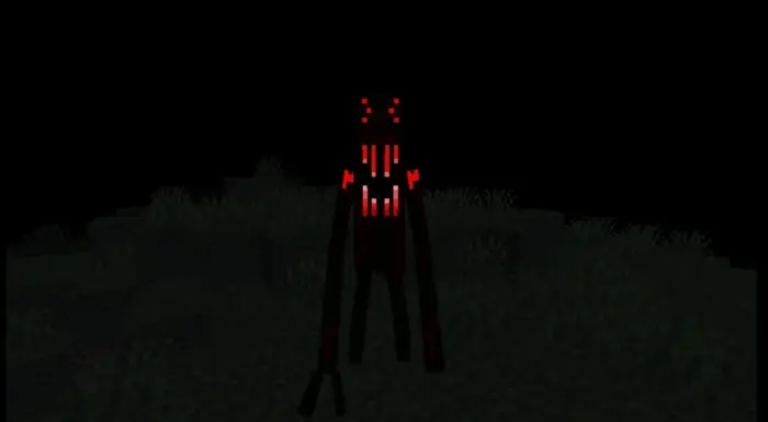 Glowing red-eyed creature in the dark