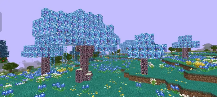 Blue-leaved trees in a vibrant flower field