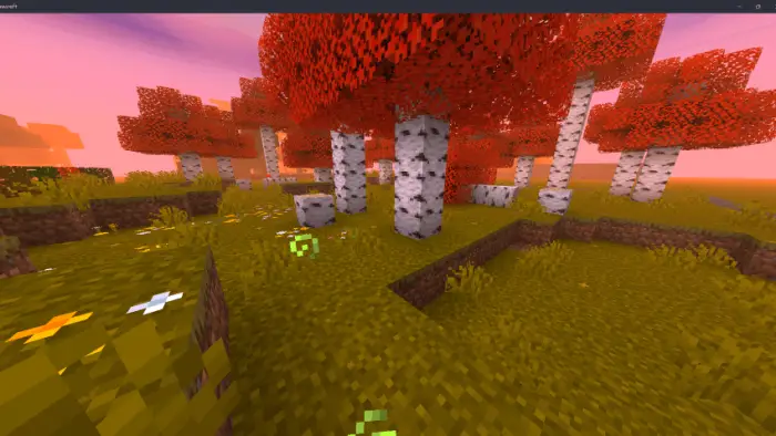 Vibrant red trees with a warm purple sky