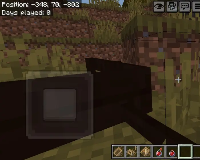 Blocky minecart near grassy hillside