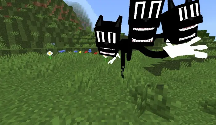 Three-headed cartoon creature in grassy field