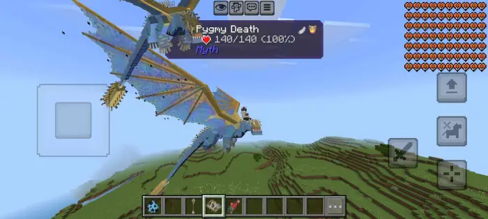 Two blue dragons flying over grassy hills